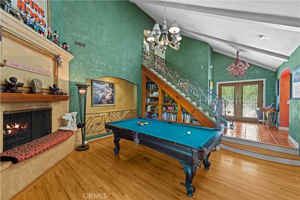 Billiard Table, Chandelier, Fireplace, Game Room, Interior, Wood Texture Flooring