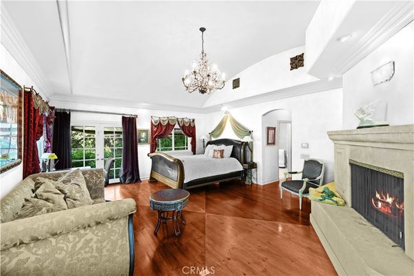Bedroom, Chandelier, Fireplace, Interior, Recessed Lighting, Wood Texture Flooring