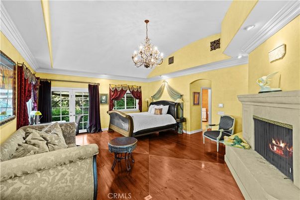 Bedroom, Chandelier, Fireplace, Interior, Recessed Lighting, Wood Texture Flooring