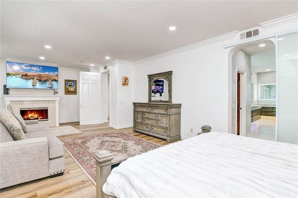 Bedroom, Fireplace, Interior, Recessed Lighting, Wood Texture Flooring