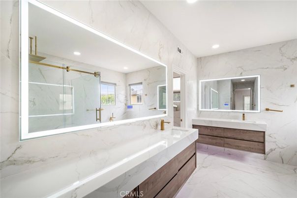 Bathroom, Dual Sink Vanities, Glass Shower, Interior, Marble, Marble Walls, Recessed Lighting