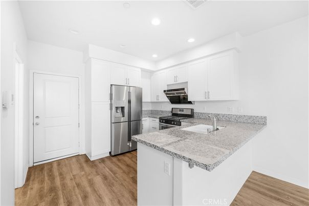 Interior, Kitchen, Recessed Lighting, Stainless Steel Appliances, Wood Texture Flooring