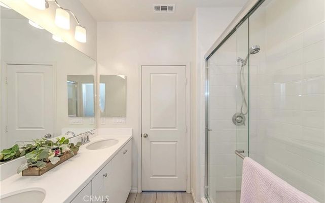 Bathroom, Dual Sink Vanities, Glass Shower, Interior, Wood Texture Flooring