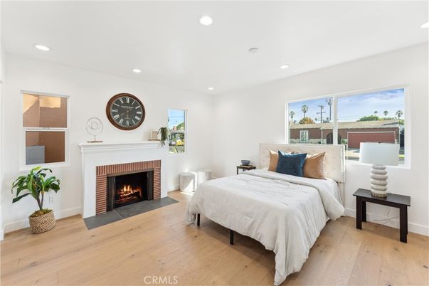 Bedroom, Fireplace, Interior, Recessed Lighting, Wood Texture Flooring