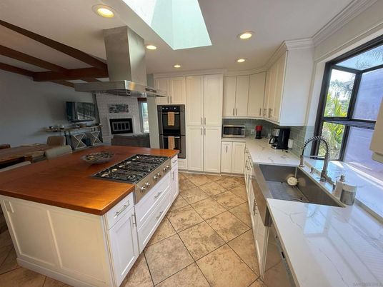 Fireplace, Interior, Kitchen, Recessed Lighting, Stainless Steel Appliances, Stone Walls, Wooden Beams