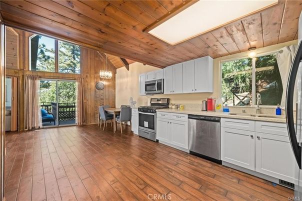 Dining room, Interior, Kitchen, Pendant Lights, Stainless Steel Appliances, Wooden Ceilings, Wood Texture Flooring, Wooden Walls