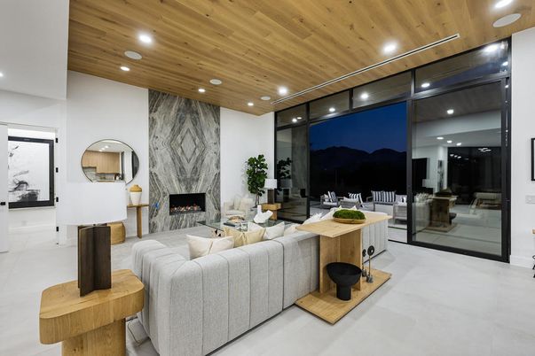 Fireplace, Interior, Living room, Marble Walls, Recessed Lighting, Wooden Ceilings