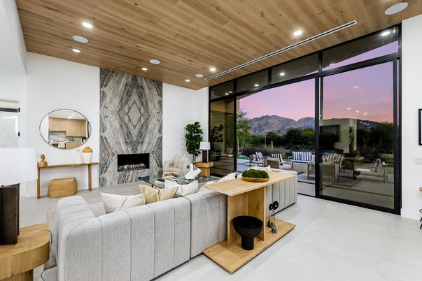 Fireplace, Interior, Living room, Marble Walls, Recessed Lighting, Wooden Ceilings
