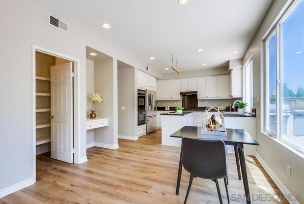 Dining room, Interior, Kitchen, Pendant Lights, Recessed Lighting, Stainless Steel Appliances, Wood Texture Flooring