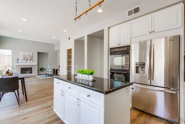 Dining room, Fireplace, Interior, Kitchen, Recessed Lighting, Stainless Steel Appliances, Wood Texture Flooring