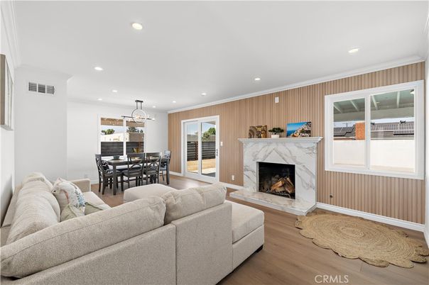 Dining room, Fireplace, Interior, Living room, Pendant Lights, Recessed Lighting, Wood Texture Flooring