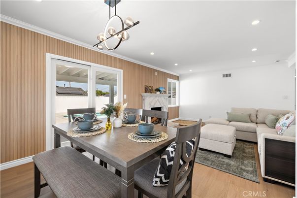 Dining room, Fireplace, Interior, Living room, Pendant Lights, Recessed Lighting, Wood Texture Flooring