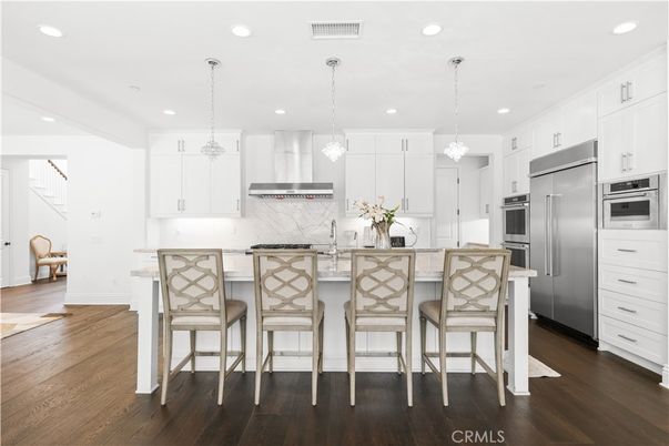 Interior, Kitchen, Marble Walls, Pendant Lights, Recessed Lighting, Stainless Steel Appliances, Wood Texture Flooring