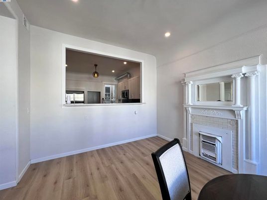 Fireplace, Interior, Kitchen, Recessed Lighting, Stainless Steel Appliances, Wood Texture Flooring
