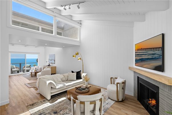 Fireplace, Interior, Living room, Recessed Lighting, Water, Wood Texture Flooring