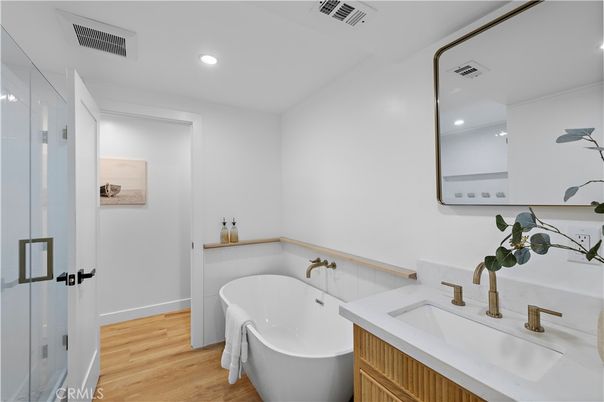 Bathroom, Dual Sink Vanities, Free Standing Baths, Interior, Recessed Lighting, Wood Texture Flooring