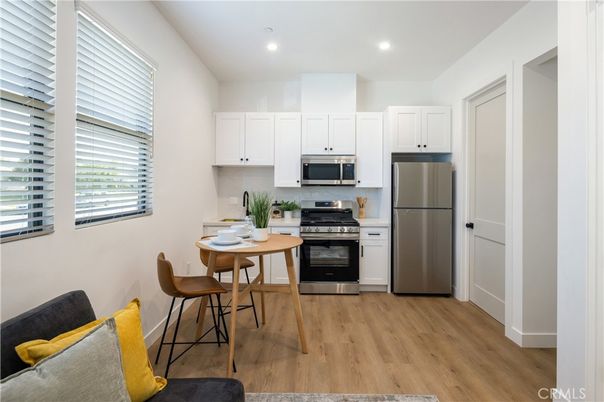Dining room, Interior, Kitchen, Recessed Lighting, Stainless Steel Appliances, Wood Texture Flooring