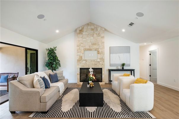 Fireplace, Interior, Living room, Recessed Lighting, Stone Walls, Wood Texture Flooring