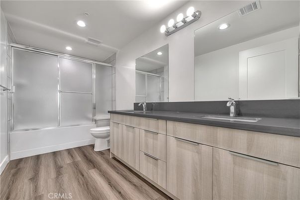 Bathroom, Dual Sink Vanities, Interior, Recessed Lighting, Wood Texture Flooring