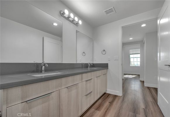 Bathroom, Dual Sink Vanities, Interior, Recessed Lighting, Wood Texture Flooring
