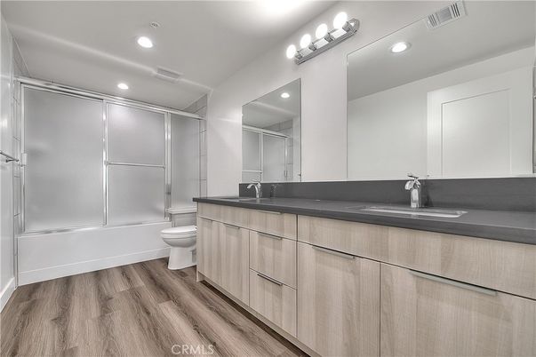 Bathroom, Dual Sink Vanities, Interior, Recessed Lighting, Wood Texture Flooring