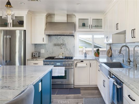 Interior, Kitchen, Marble Walls, Recessed Lighting, Stainless Steel Appliances, Wood Texture Flooring