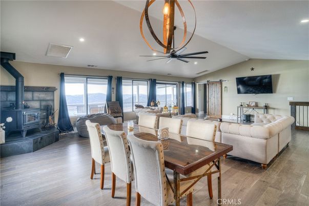 Dining room, Fireplace, Interior, Living room, Recessed Lighting, Wood Texture Flooring