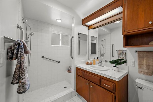 Bathroom, Dual Sink Vanities, Interior, Recessed Lighting, Tile Countertops