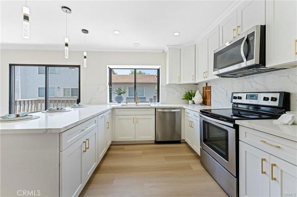Interior, Kitchen, Marble Walls, Pendant Lights, Recessed Lighting, Stainless Steel Appliances, Wood Texture Flooring