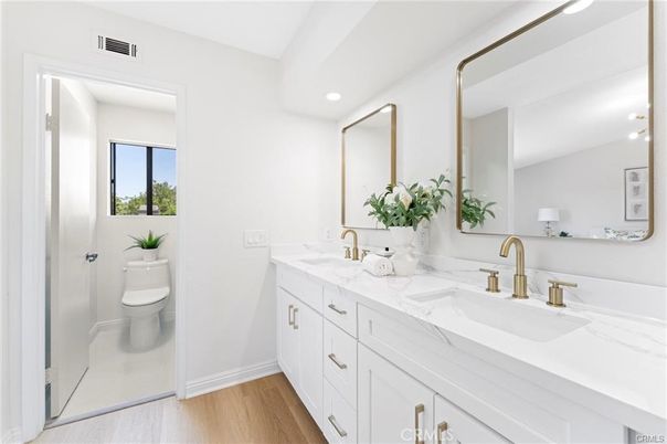Bathroom, Dual Sink Vanities, Interior, Recessed Lighting, Wood Texture Flooring