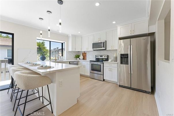 Interior, Kitchen, Marble Walls, Pendant Lights, Recessed Lighting, Stainless Steel Appliances, Wood Texture Flooring