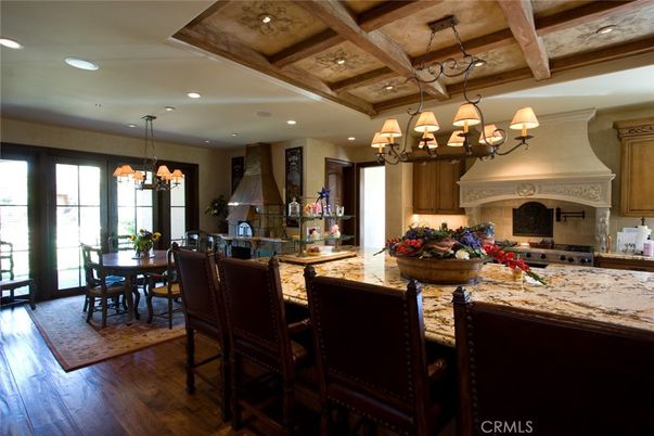 Chandelier, Dining room, Interior, Kitchen, Recessed Lighting, Stainless Steel Appliances, Wooden Beams, Wood Texture Flooring