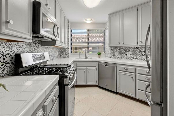 Interior, Kitchen, Stainless Steel Appliances, Tile Countertops