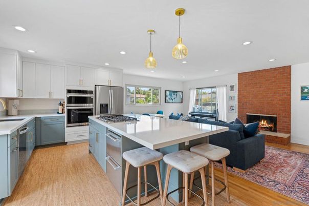 Fireplace, Interior, Kitchen, Living room, Pendant Lights, Recessed Lighting, Stainless Steel Appliances, Stone Walls, Wood Texture Flooring