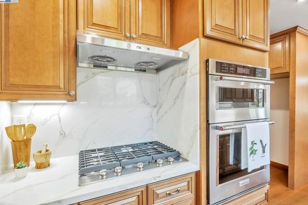 Interior, Kitchen, Marble Walls, Stainless Steel Appliances, Wood Texture Flooring