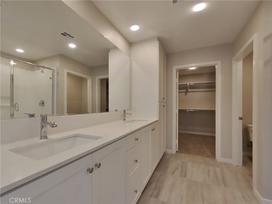 Bathroom, Dual Sink Vanities, Glass Shower, Interior, Recessed Lighting, Walk-in Closets