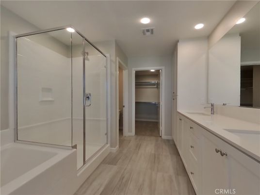 Bathroom, Dual Sink Vanities, Glass Shower, Interior, Recessed Lighting, Walk-in Closets