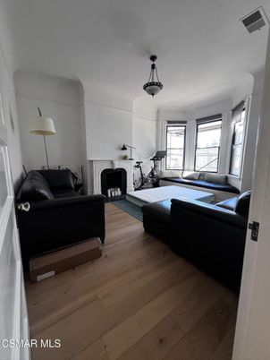 Fireplace, Fitness Equipment, Interior, Living room, Pendant Lights, Wood Texture Flooring