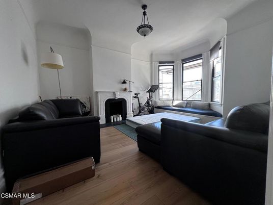 Fireplace, Fitness Equipment, Interior, Living room, Pendant Lights, Wood Texture Flooring