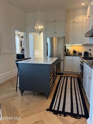 Chandelier, Interior, Kitchen, Pendant Lights, Recessed Lighting, Stainless Steel Appliances, Wood Texture Flooring