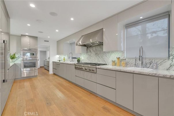 Interior, Kitchen, Marble Walls, Recessed Lighting, Stainless Steel Appliances, Wood Texture Flooring