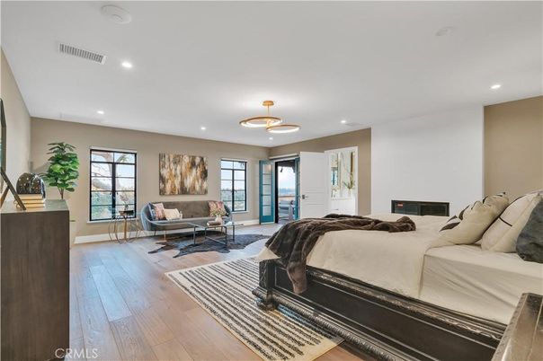 Bedroom, Fireplace, Interior, Pendant Lights, Recessed Lighting, Wood Texture Flooring