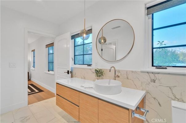 Bathroom, Dual Sink Vanities, Interior, Marble, Marble Walls, Pendant Lights, Wood Texture Flooring