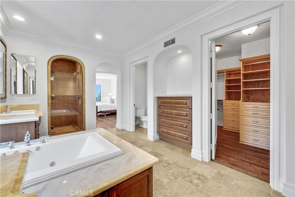 Bathroom, Dual Sink Vanities, Glass Shower, Interior, Recessed Lighting, Wood Texture Flooring