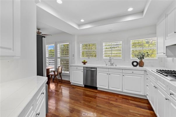Dining room, Interior, Kitchen, Recessed Lighting, Stainless Steel Appliances, Tile Countertops, Wood Texture Flooring
