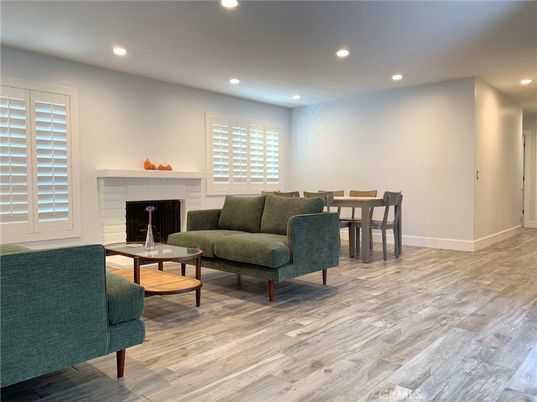 Dining room, Fireplace, Interior, Living room, Recessed Lighting, Wood Texture Flooring