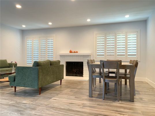 Dining room, Fireplace, Interior, Living room, Recessed Lighting, Wood Texture Flooring