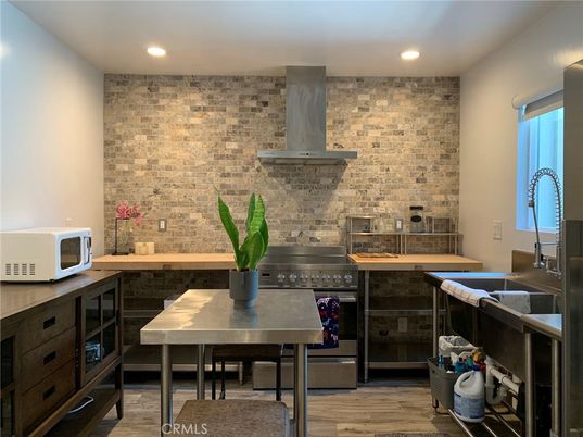 Interior, Kitchen, Recessed Lighting, Stainless Steel Appliances, Stone Walls, Wood Texture Flooring