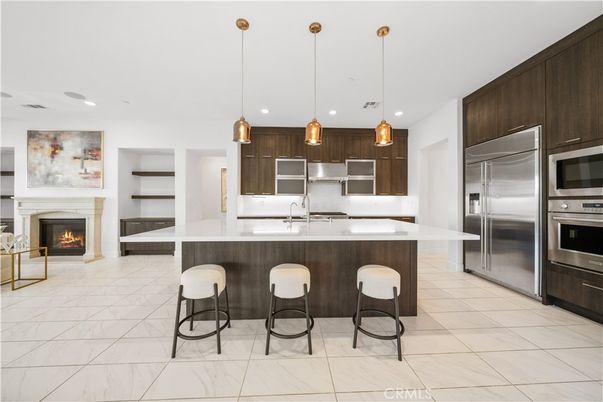 Fireplace, Interior, Kitchen, Marble, Pendant Lights, Recessed Lighting, Stainless Steel Appliances