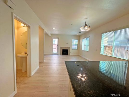 Bathroom, Chandelier, Empty room, Fireplace, Interior, Recessed Lighting, Wood Texture Flooring